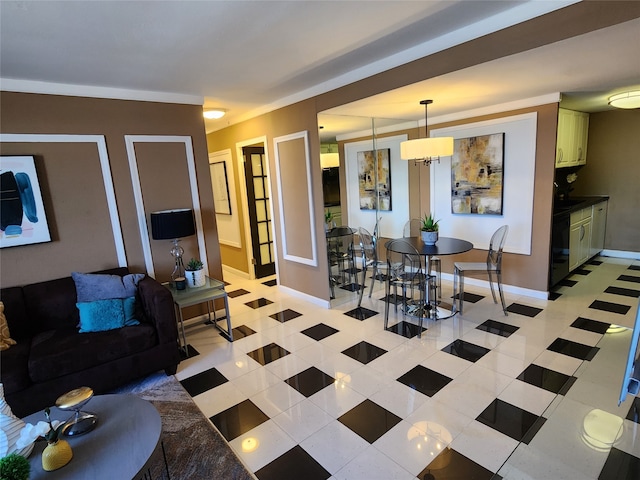 tiled living room with a notable chandelier