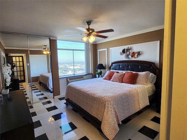 bedroom with a closet, ceiling fan, and crown molding