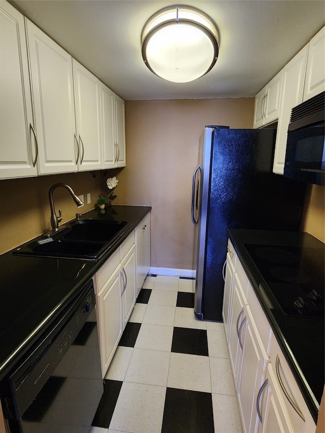 kitchen with sink, white cabinetry, and black appliances