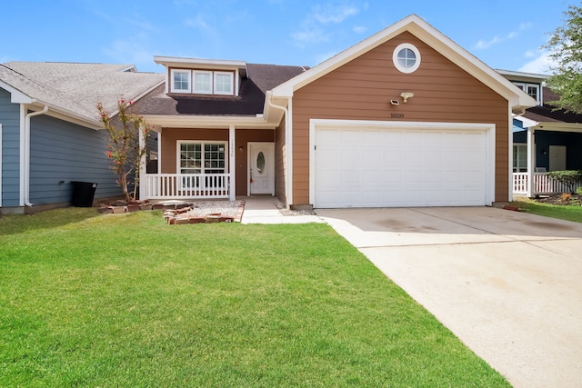 view of front facade featuring covered porch, a garage, and a front yard