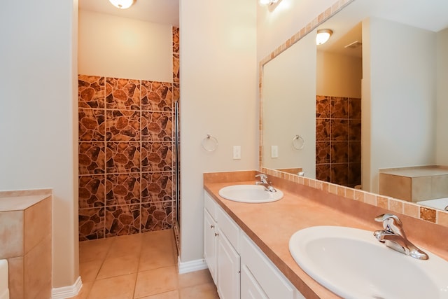 bathroom with tile patterned floors and vanity