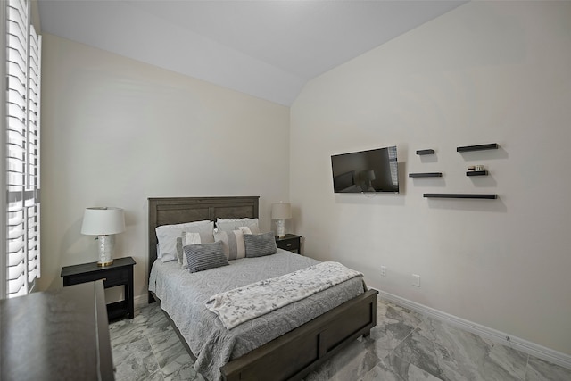 bedroom featuring vaulted ceiling