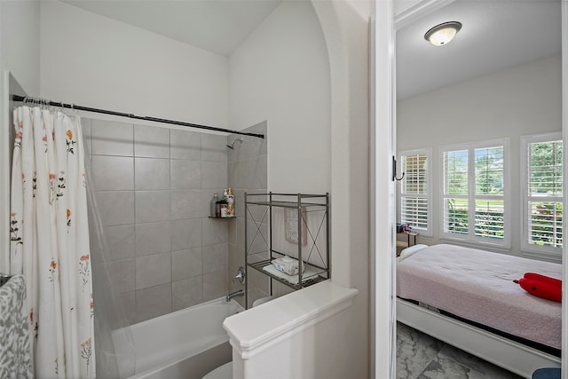 bathroom featuring shower / bathtub combination with curtain