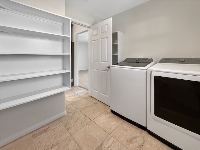 laundry room with washing machine and dryer