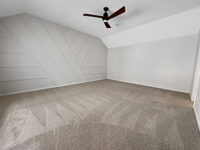 bonus room with ceiling fan, lofted ceiling, and carpet floors