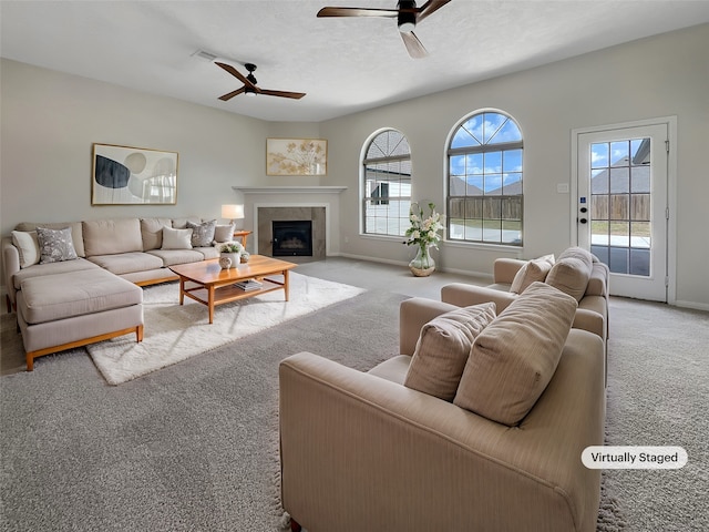 living room featuring light colored carpet and ceiling fan