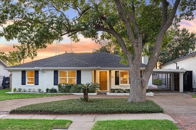 view of front of property with a carport