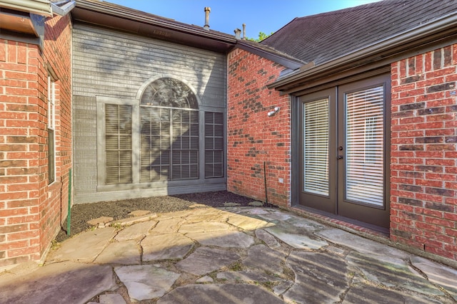 doorway to property featuring a patio area and french doors