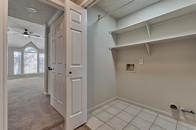 laundry area with ceiling fan, hookup for a washing machine, light tile patterned flooring, and gas dryer hookup