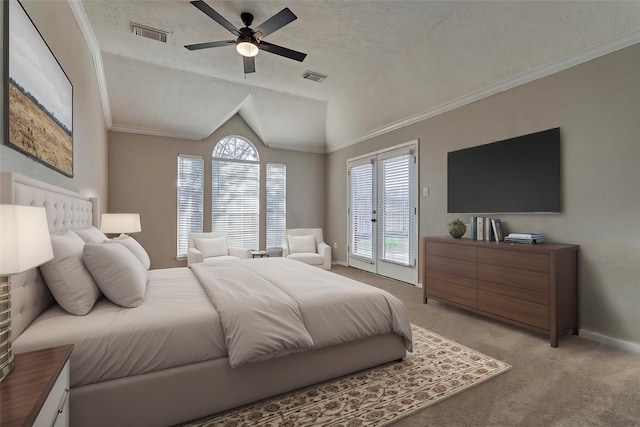 bedroom with a textured ceiling, light colored carpet, ceiling fan, and lofted ceiling