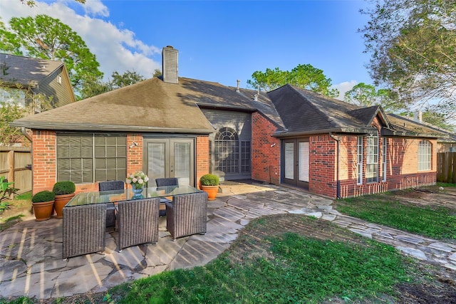 back of property featuring a patio area and french doors