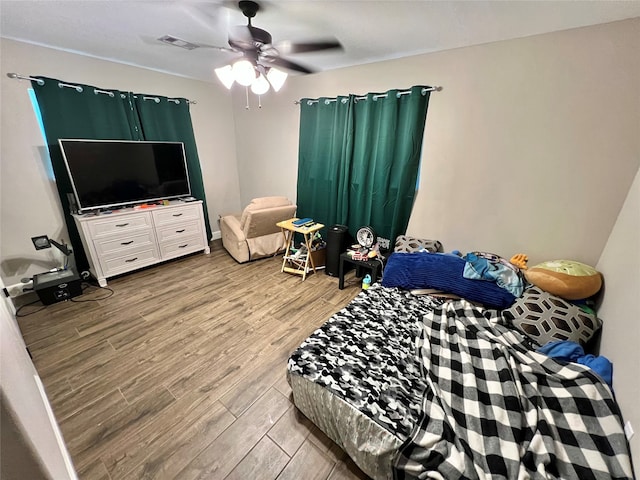 bedroom featuring ceiling fan and light hardwood / wood-style flooring