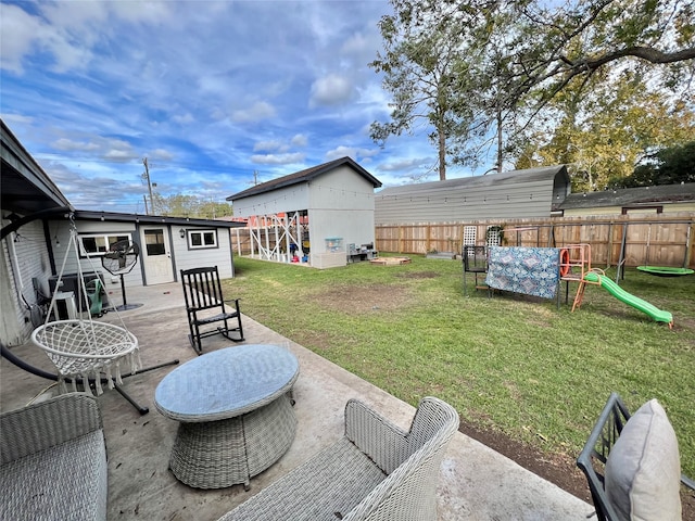 view of yard featuring a patio area and an outbuilding