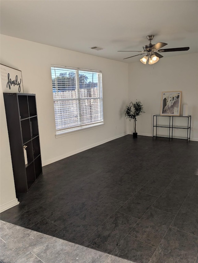 unfurnished room featuring ceiling fan