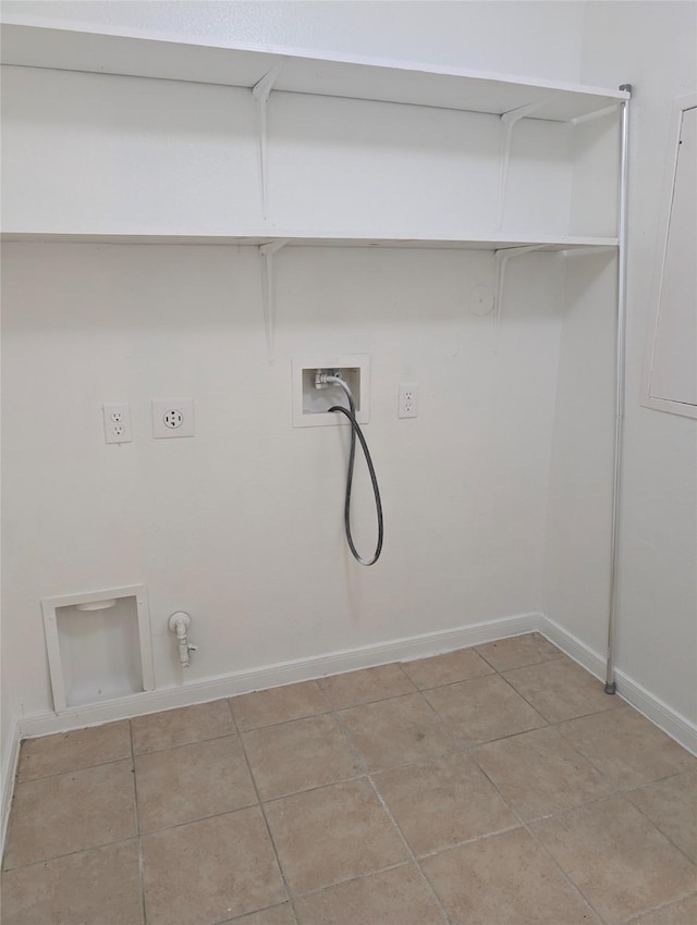 laundry area featuring electric dryer hookup, hookup for a gas dryer, light tile patterned flooring, and washer hookup