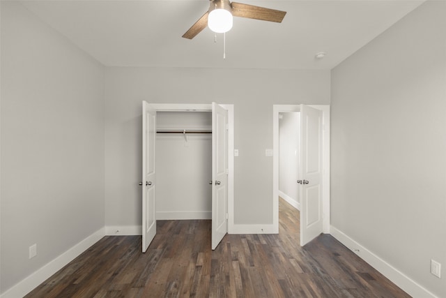 unfurnished bedroom featuring dark hardwood / wood-style flooring, a closet, and ceiling fan