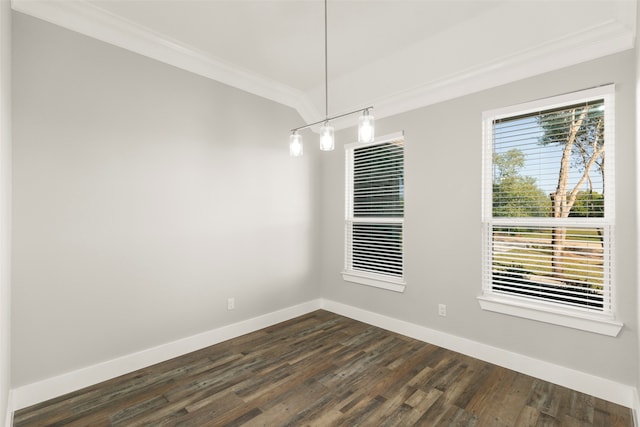 empty room with dark hardwood / wood-style flooring and ornamental molding