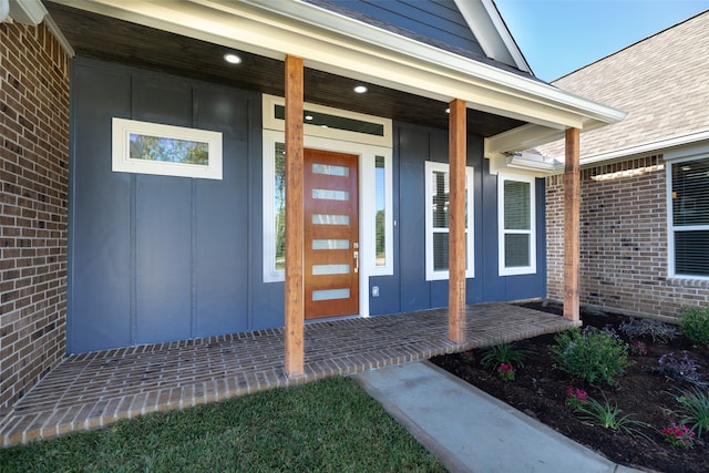 property entrance with covered porch