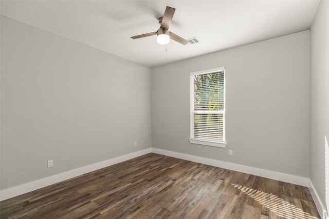 unfurnished room featuring dark hardwood / wood-style floors and ceiling fan