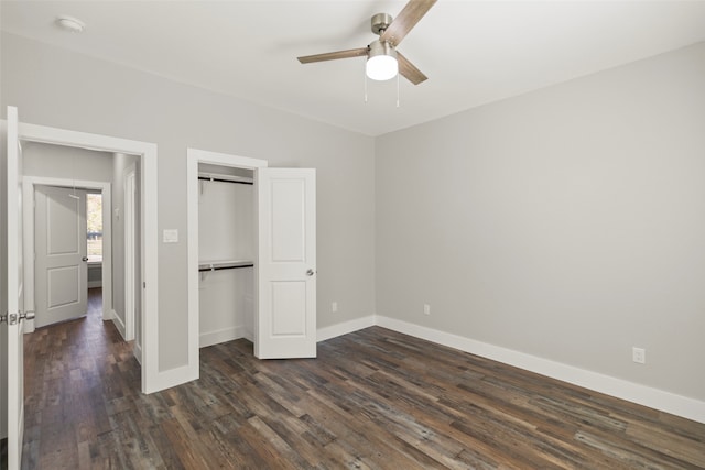 unfurnished bedroom with ceiling fan and dark hardwood / wood-style floors