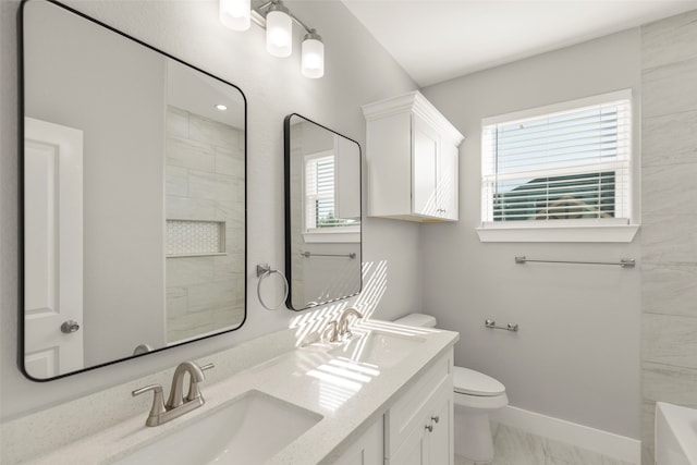 bathroom with vanity and toilet