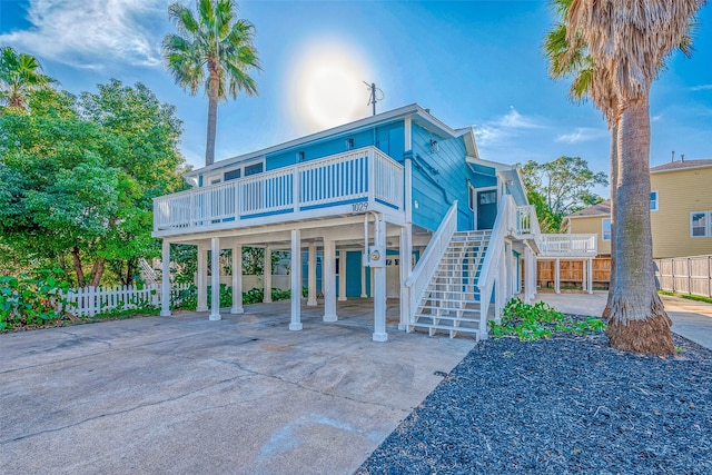 coastal inspired home featuring a carport