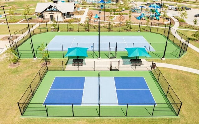 view of tennis court with fence