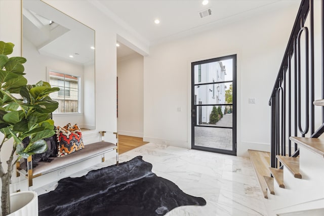 foyer with light hardwood / wood-style floors