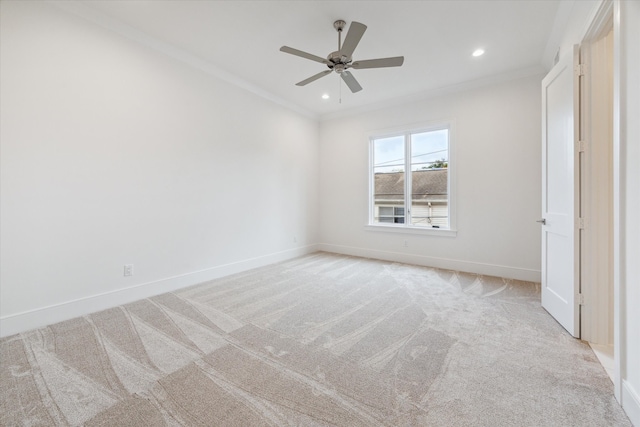 unfurnished bedroom featuring ceiling fan, light carpet, and ornamental molding