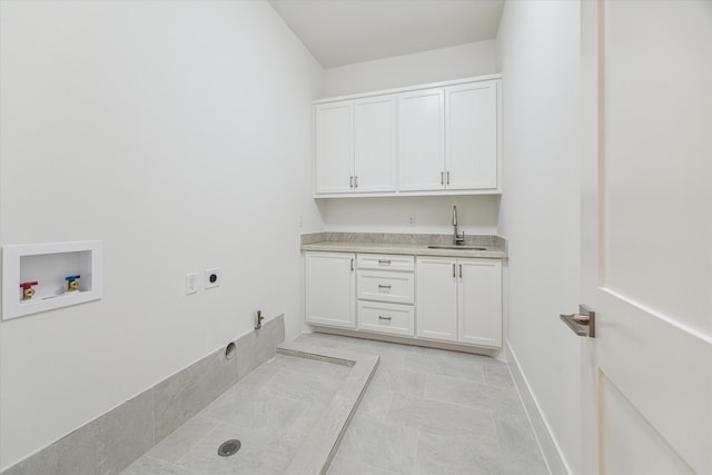 clothes washing area with sink, cabinets, electric dryer hookup, gas dryer hookup, and hookup for a washing machine