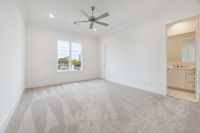 carpeted empty room with ceiling fan and ornamental molding