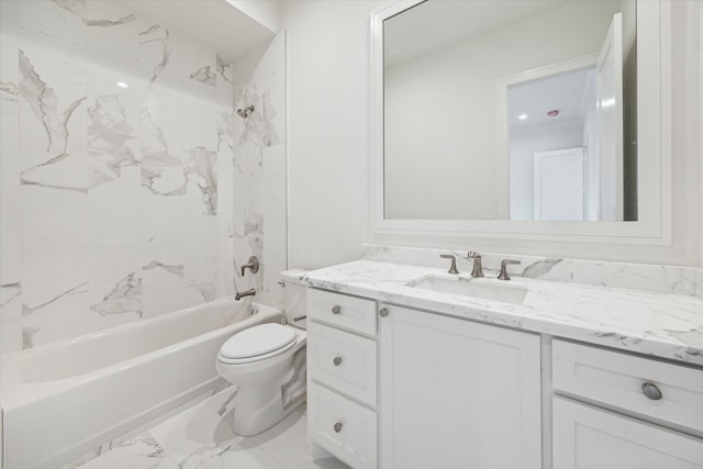 full bathroom featuring vanity, toilet, and tiled shower / bath