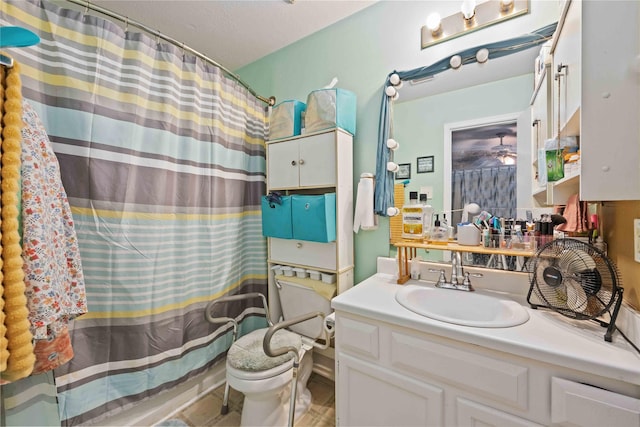 full bathroom with toilet, vanity, and shower / tub combo