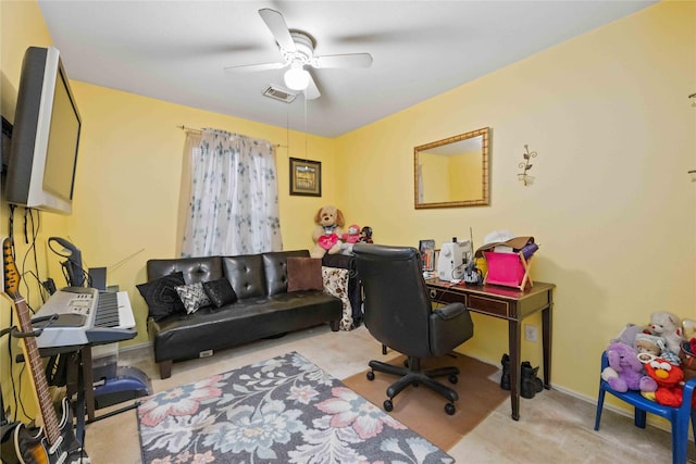 carpeted home office with ceiling fan