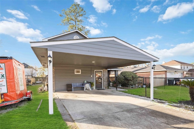 view of front of property with a front lawn and a carport