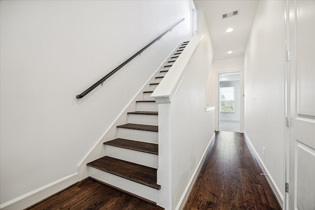 stairs with baseboards, visible vents, wood finished floors, and recessed lighting