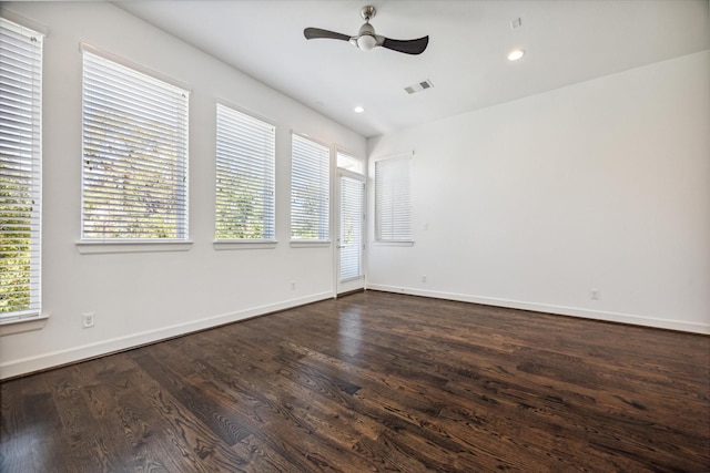 unfurnished room featuring ceiling fan and dark hardwood / wood-style flooring