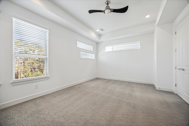 carpeted empty room featuring ceiling fan