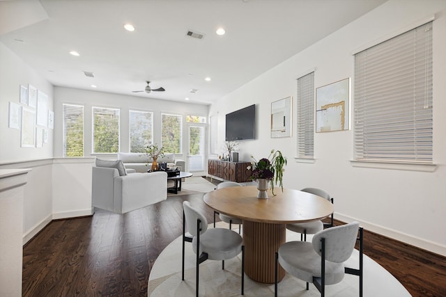 dining room featuring dark wood-type flooring and ceiling fan