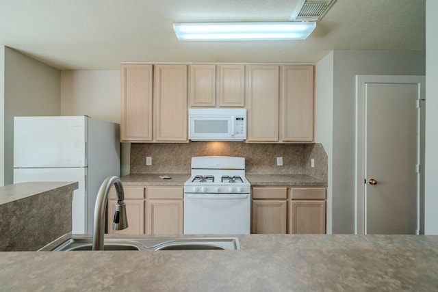 kitchen featuring decorative backsplash, light brown cabinets, white appliances, and sink