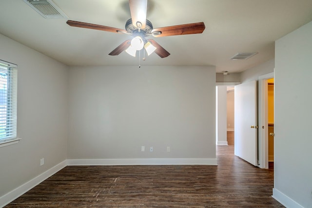 spare room with ceiling fan and dark hardwood / wood-style flooring