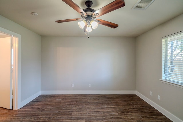 unfurnished room featuring ceiling fan and dark wood-type flooring