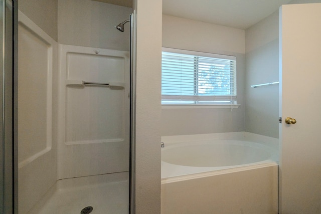 bathroom featuring plus walk in shower