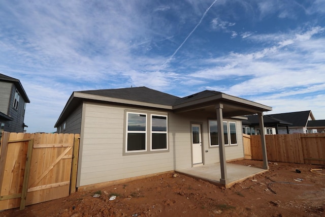 back of property featuring a patio