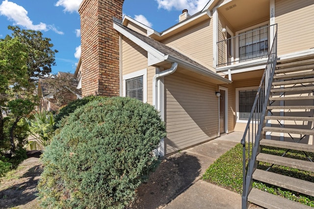 view of home's exterior with a balcony