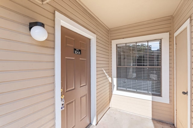 doorway to property featuring a porch