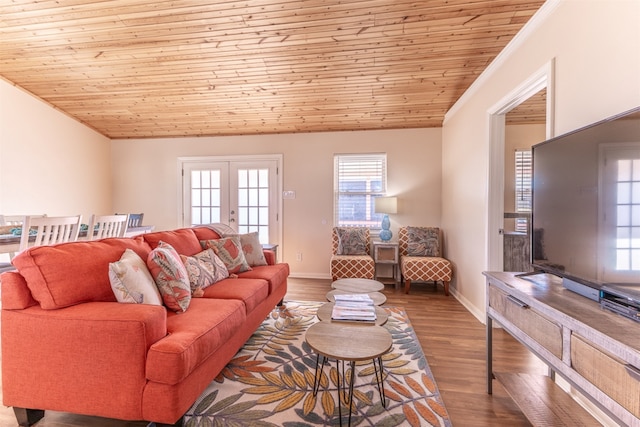 living area with vaulted ceiling, wooden ceiling, and wood finished floors