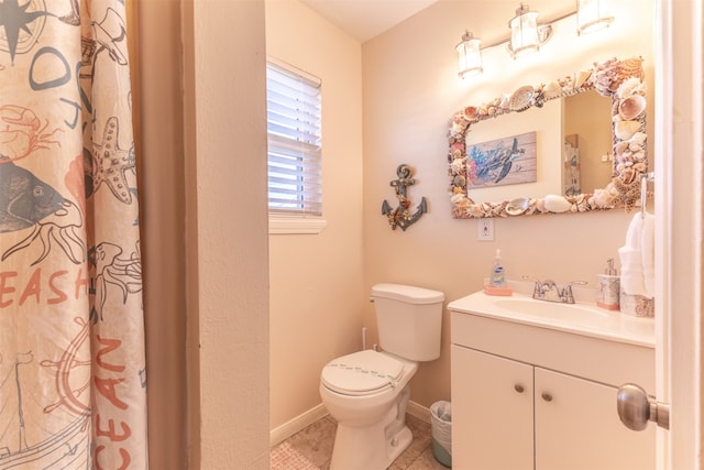 full bath with tile patterned floors, toilet, vanity, and baseboards