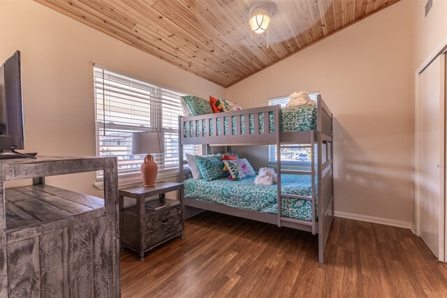 bedroom with wood finished floors, visible vents, baseboards, vaulted ceiling, and wood ceiling