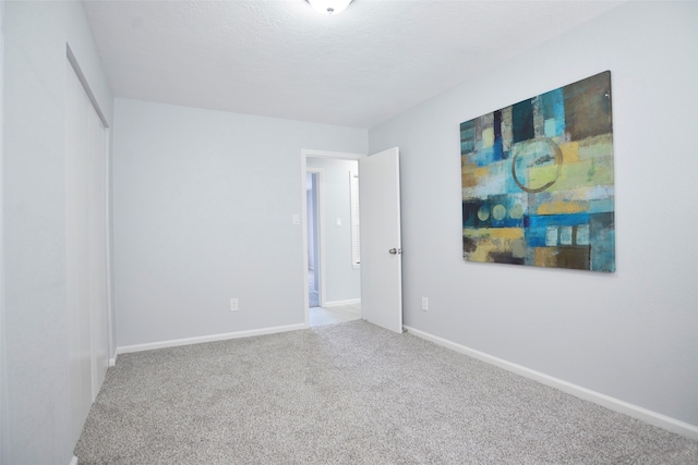 unfurnished room with carpet